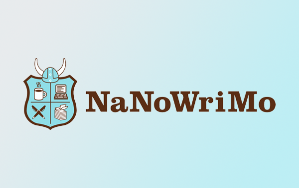 NaNoWriMo logo, brown NaNoWriMo text, icon-illustration-style light blue and brown shield divided into four with icons in each quadrant clockwise from top left: a cup of coffee, a laptop, a stack of papers with the top two pages curling up, and two pens crossed; a Viking-style helmet sits on top of the shield
