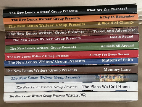 Stack of anthologies written by New Lenox Writers Group