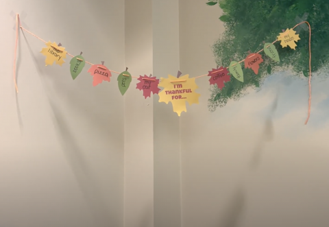 Paper leaf banner with thankful sayings on the leaves
